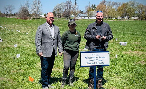 From left, His Worship North Dundas Mayor, Tony Fraser, Forester at South Nation Conservation Caroline Goulet, and Lactalis Canada Plant Director Bruce Shurtleff participate in a tree planting initiative at Winchester site as part of new partnership South Nation Conservation to create 12-Acre Forest at Winchester site